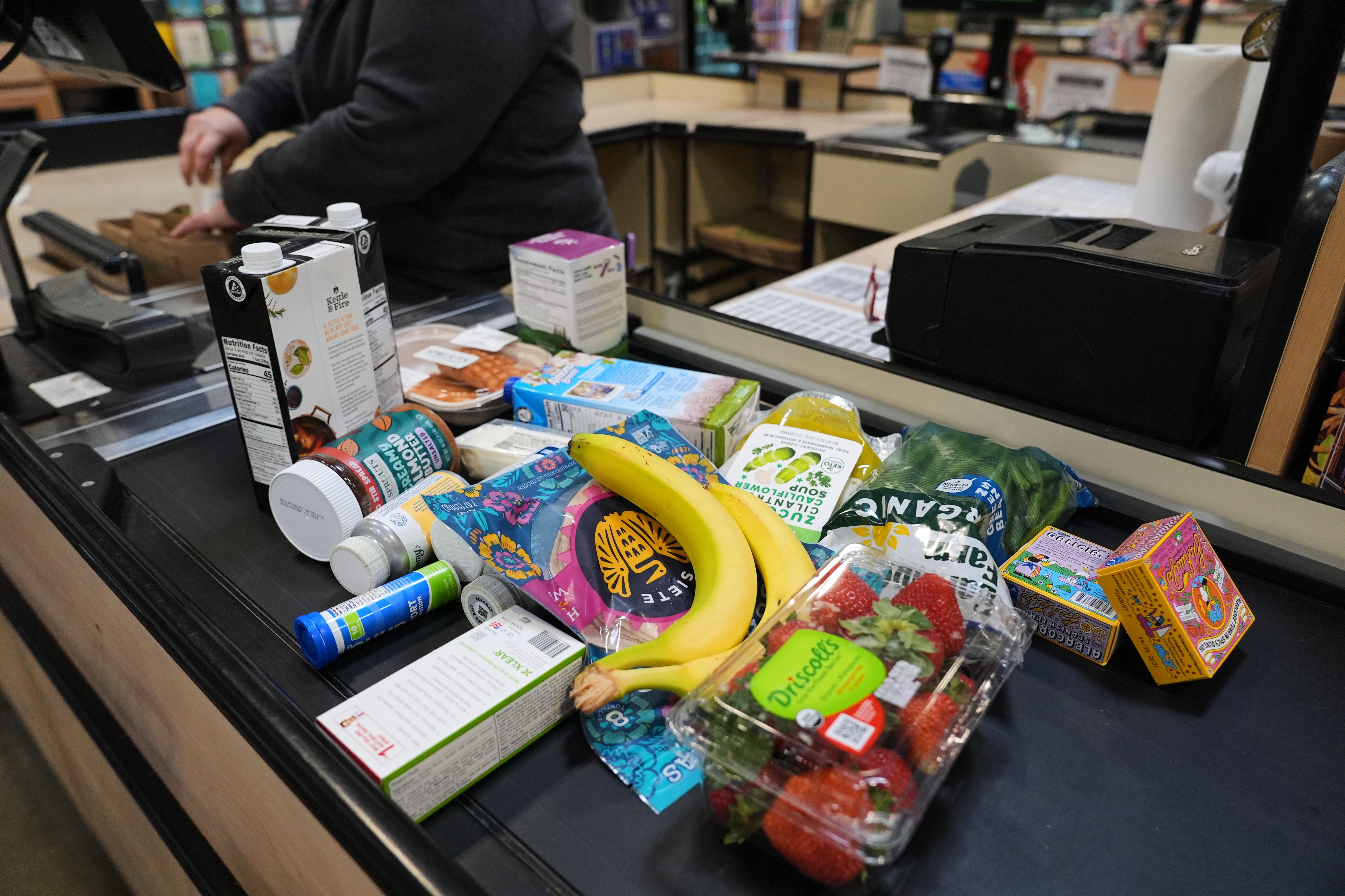 A cashier scans groceries, including produce, which is covered by the USDA Supplemental Nutrition Assistance Program (SNAP), at a grocery store in Baltimore on Monday.